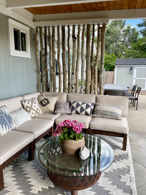 decorative aspen poles installed in a patio